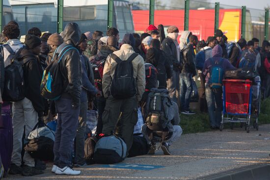 Relocation continues at Jungle spontaneous refugee camp in Calais, France