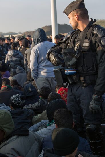 Relocation continues at Jungle spontaneous refugee camp in Calais, France