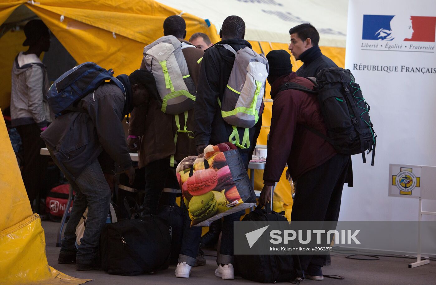 Relocation continues at Jungle spontaneous refugee camp in Calais, France