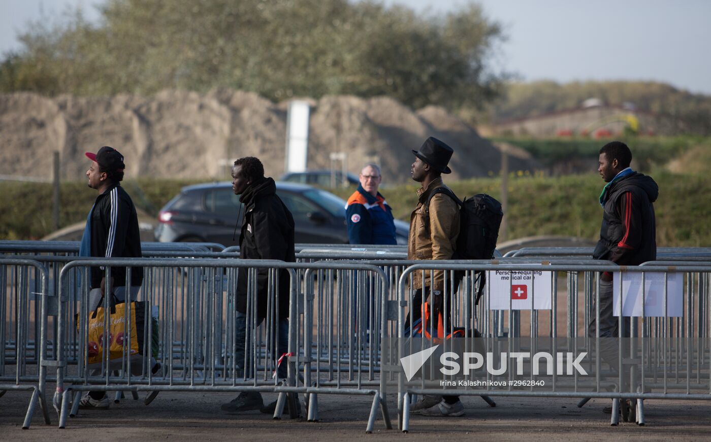 Relocation continues at Jungle spontaneous refugee camp in Calais, France