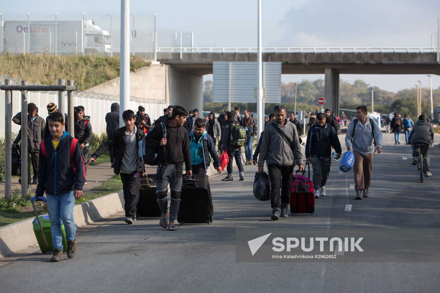 Relocation continues at Jungle spontaneous refugee camp in Calais, France