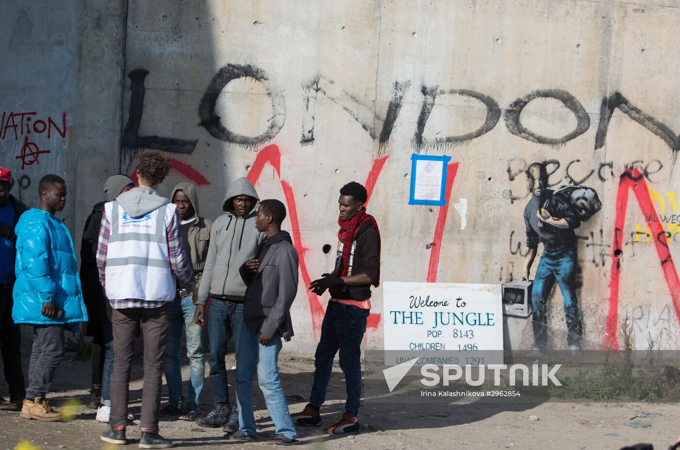 Relocation continues at Jungle spontaneous refugee camp in Calais, France