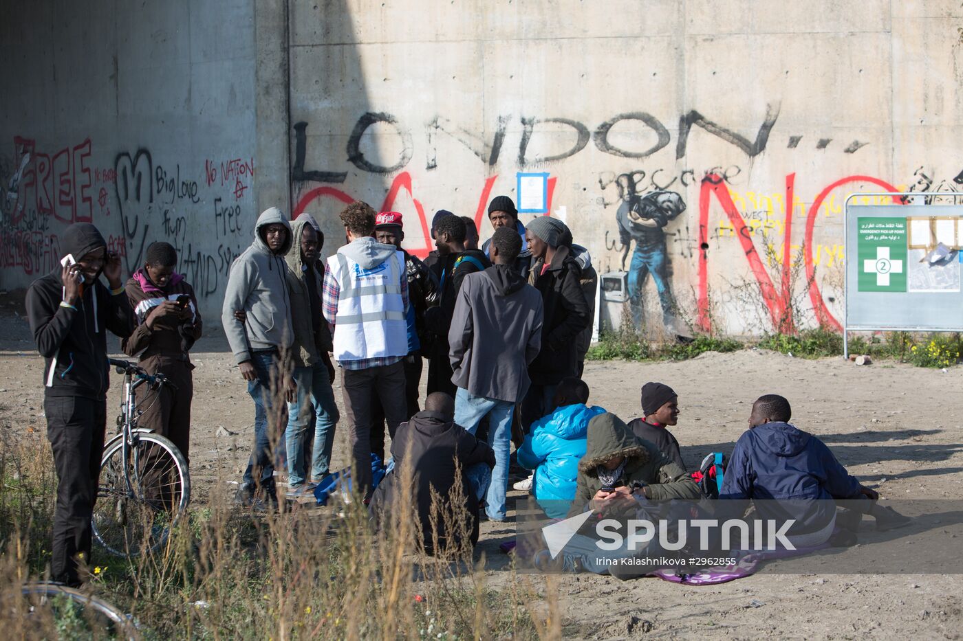 Relocation continues at Jungle spontaneous refugee camp in Calais, France