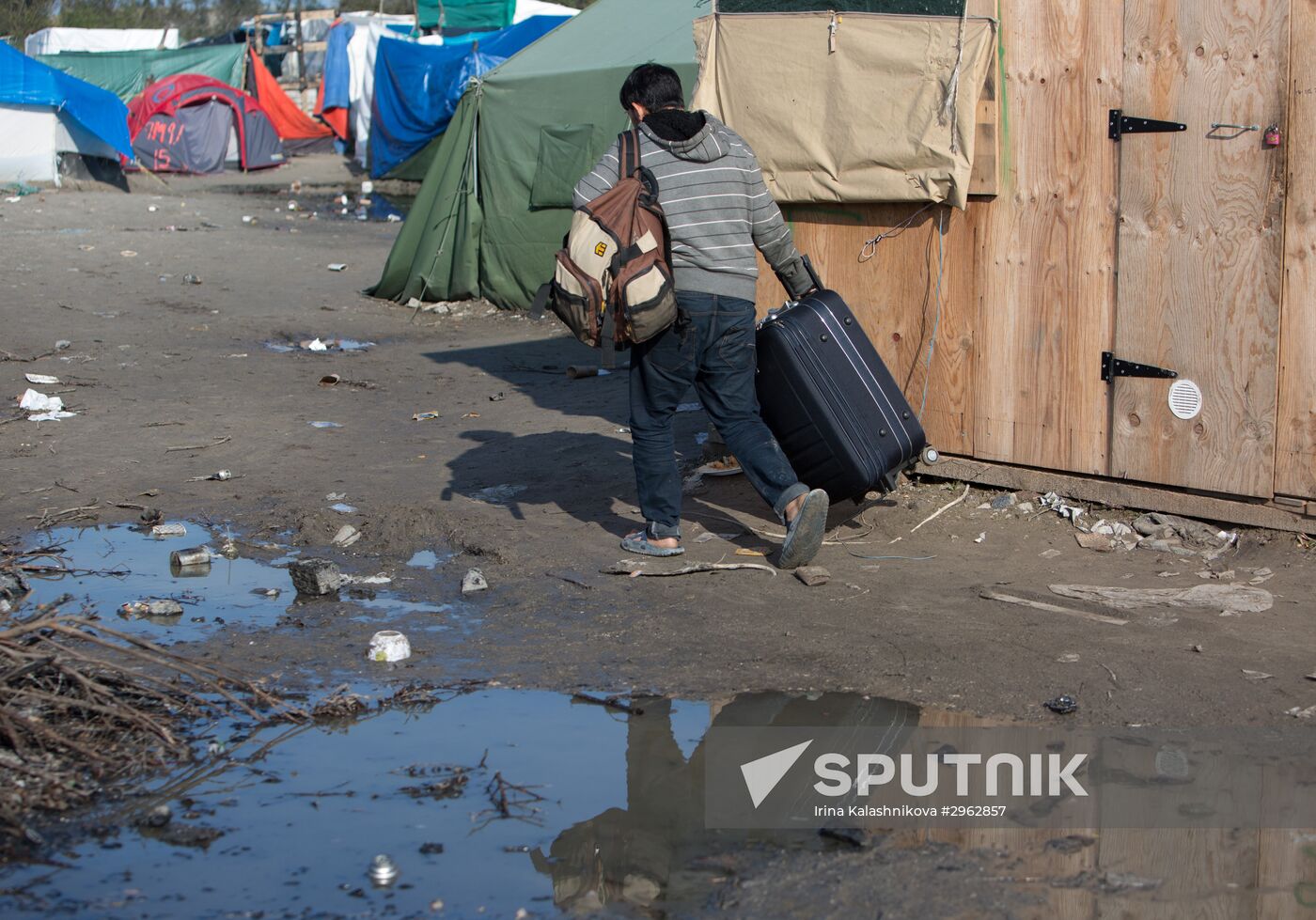 Relocation continues at Jungle spontaneous refugee camp in Calais, France