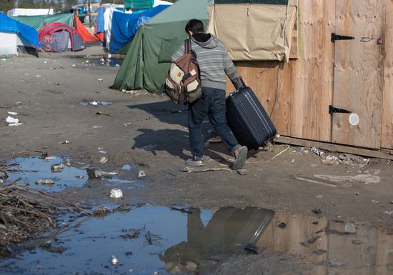 Relocation continues at Jungle spontaneous refugee camp in Calais, France