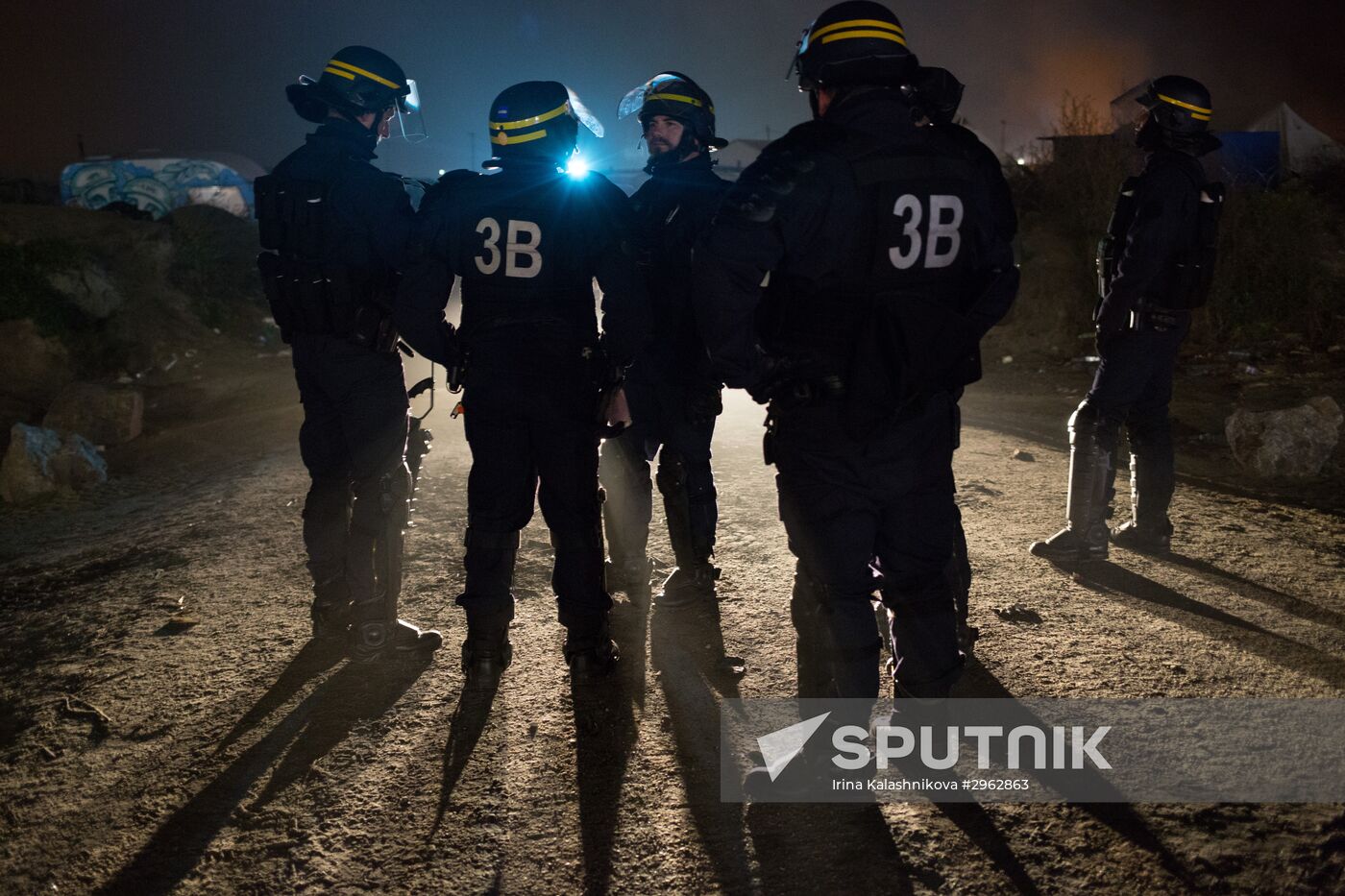 Relocation continues at Jungle spontaneous refugee camp in Calais, France