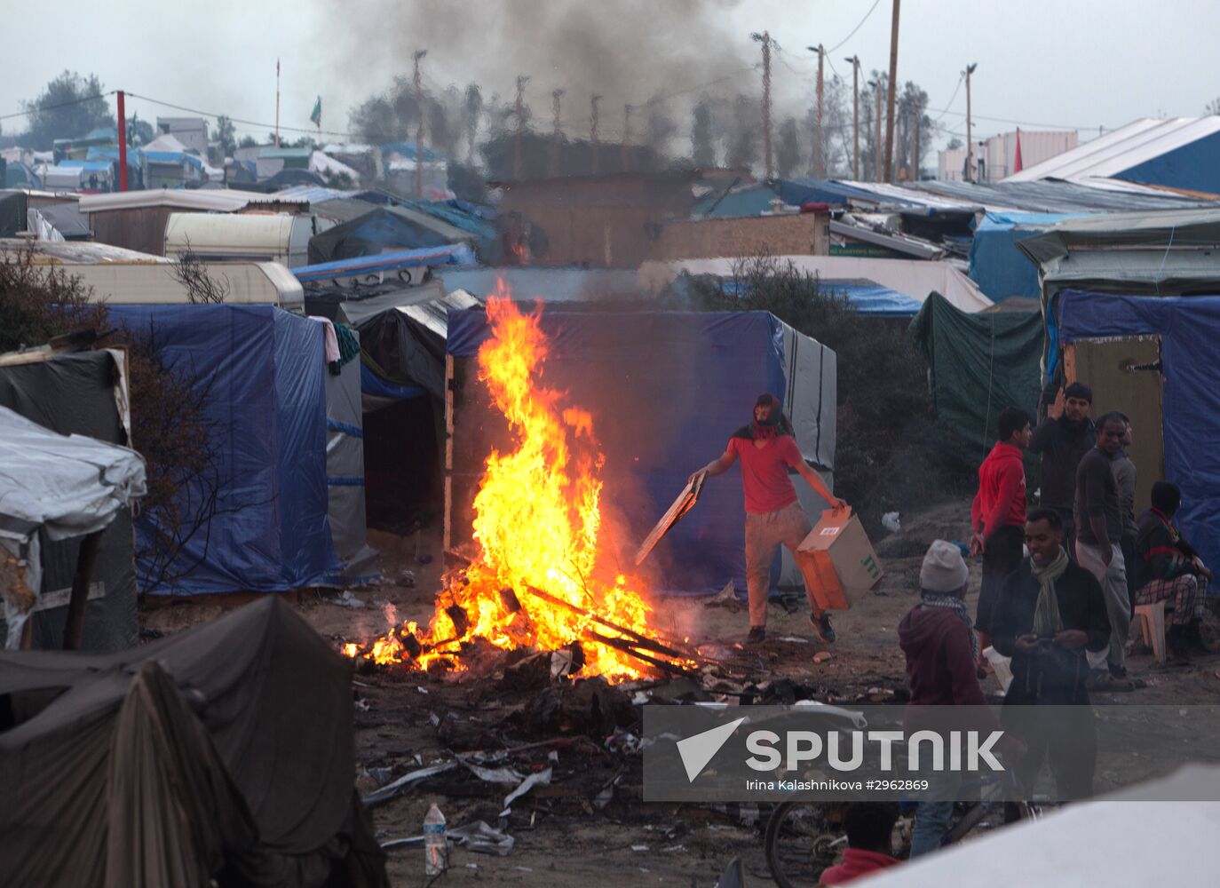 Relocation continues at Jungle spontaneous refugee camp in Calais, France