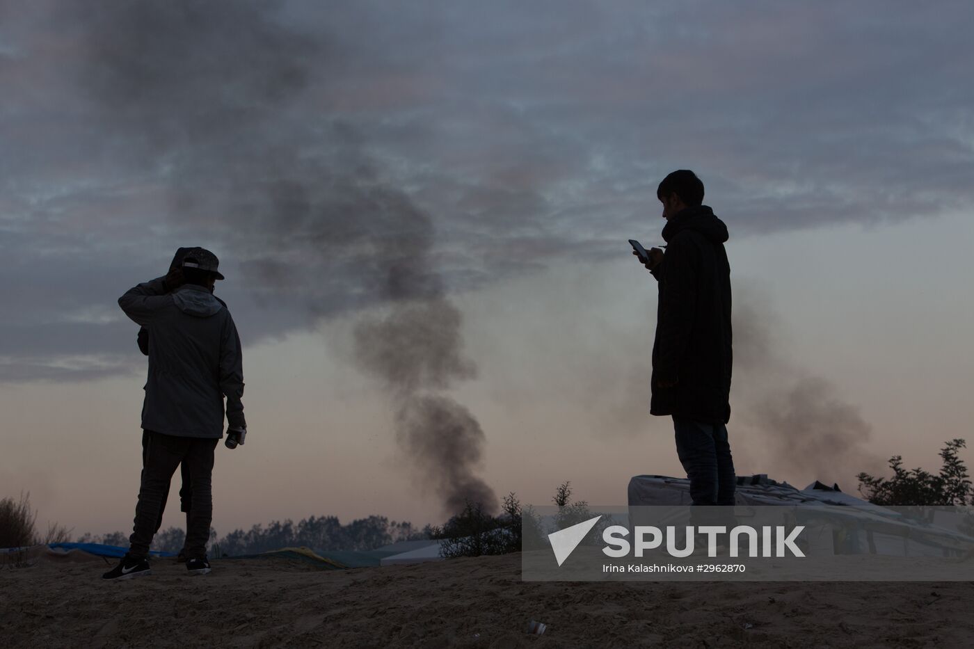 Relocation continues at Jungle spontaneous refugee camp in Calais, France