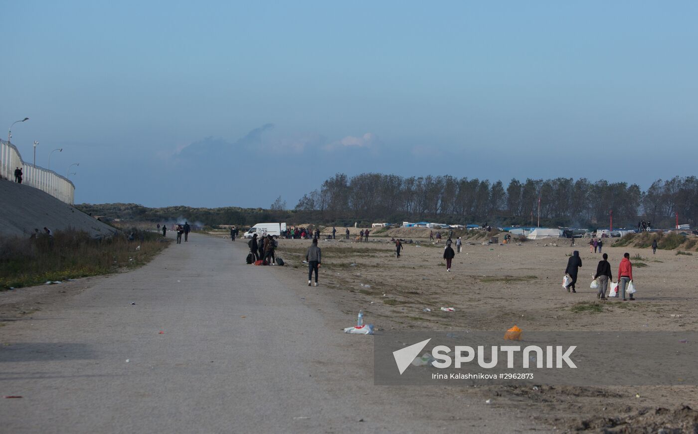 Relocation continues at Jungle spontaneous refugee camp in Calais, France