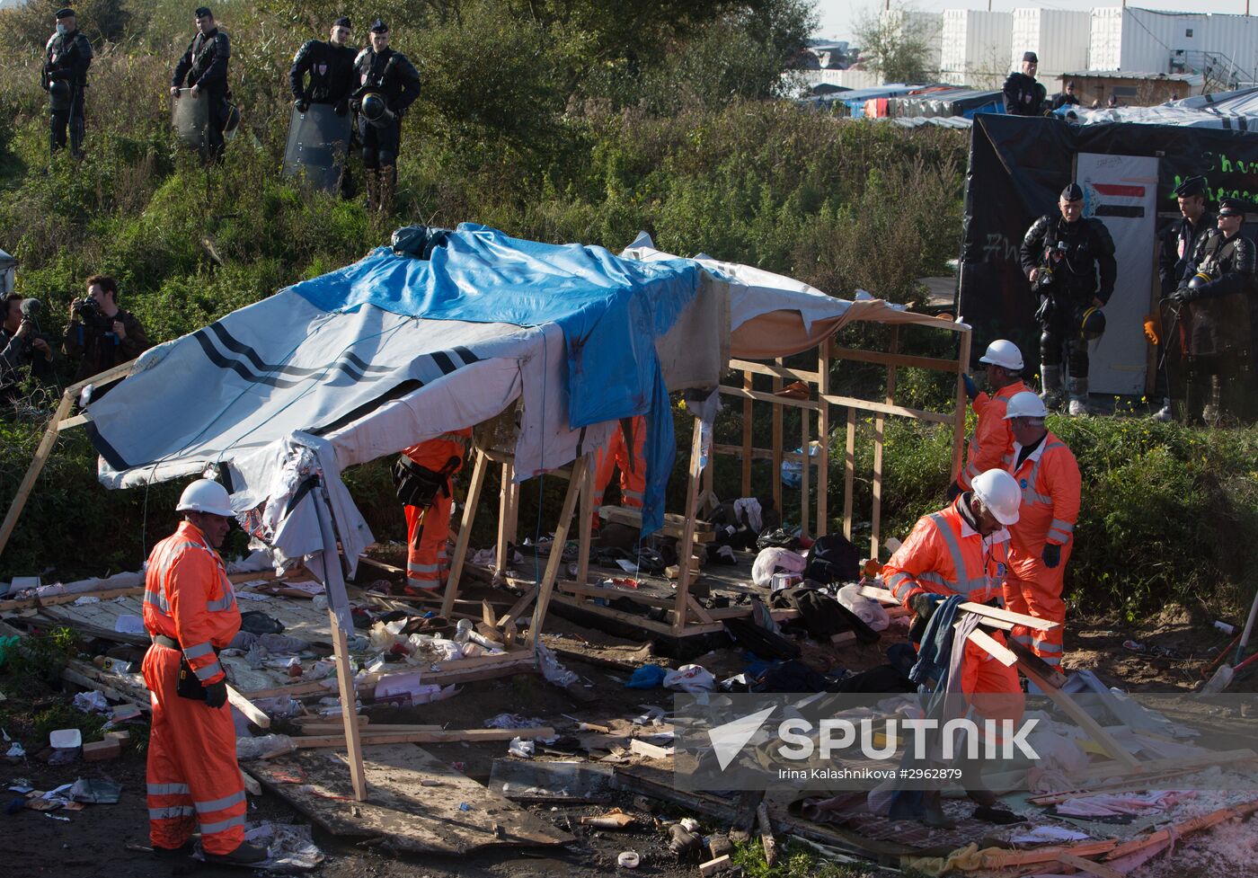 Relocation continues at Jungle spontaneous refugee camp in Calais, France