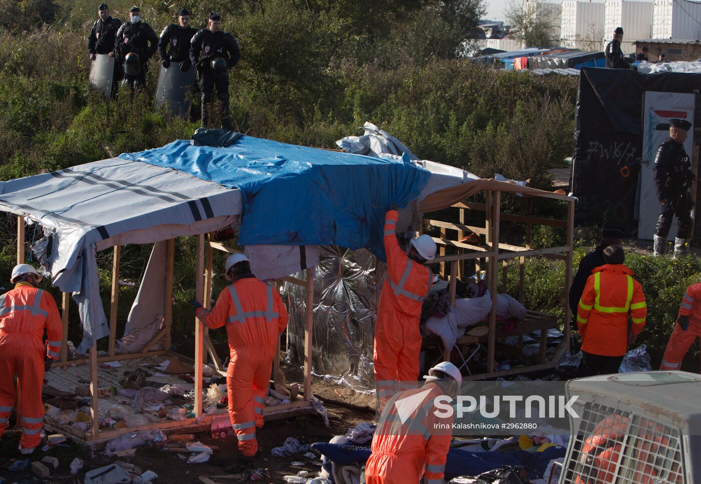 Relocation continues at Jungle spontaneous refugee camp in Calais, France