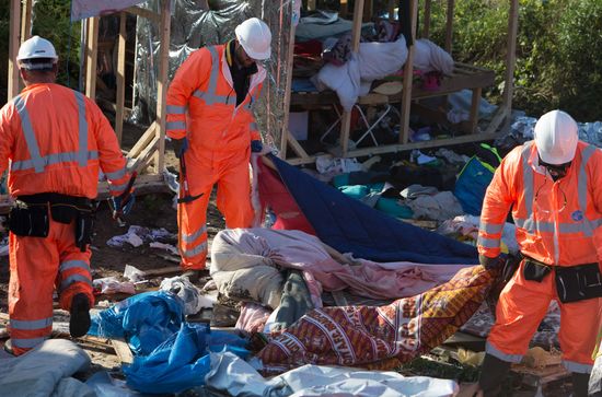 Relocation continues at Jungle spontaneous refugee camp in Calais, France
