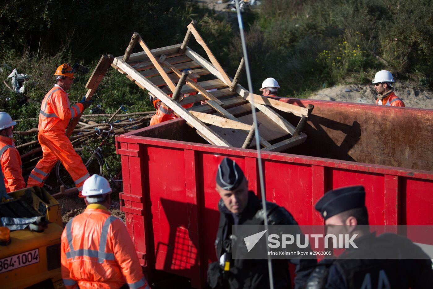 Relocation continues at Jungle spontaneous refugee camp in Calais, France