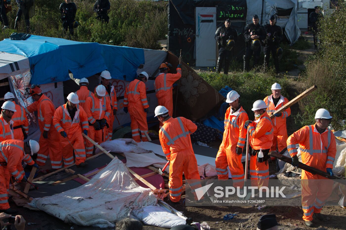 Relocation continues at Jungle spontaneous refugee camp in Calais, France