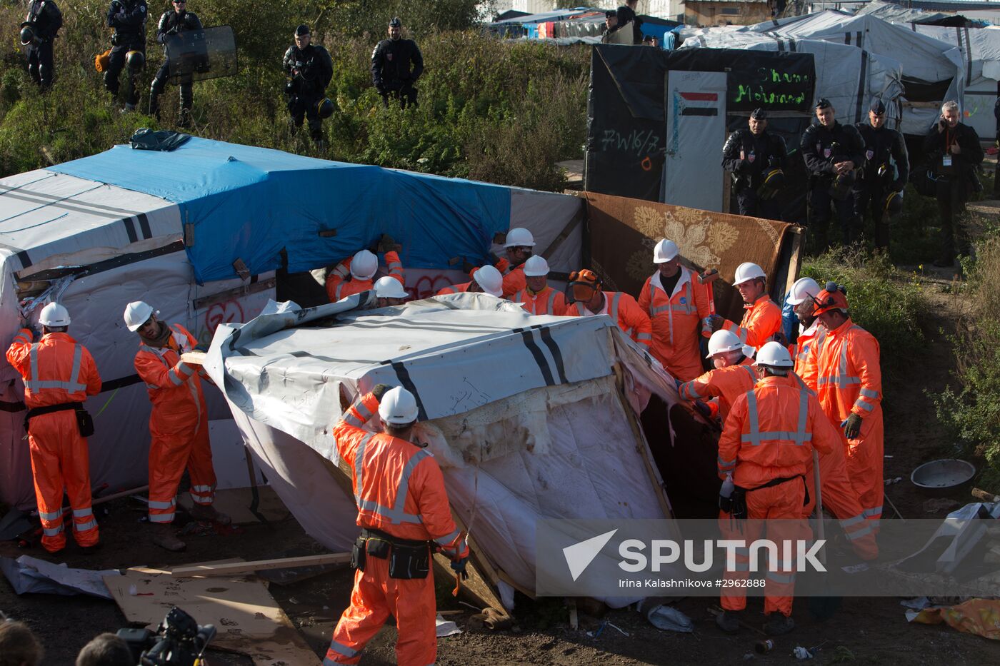 Relocation continues at Jungle spontaneous refugee camp in Calais, France