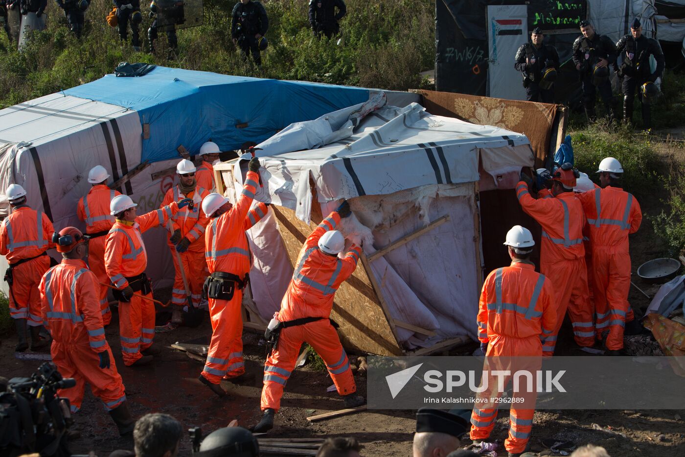 Relocation continues at Jungle spontaneous refugee camp in Calais, France