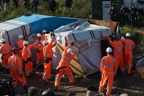 Relocation continues at Jungle spontaneous refugee camp in Calais, France