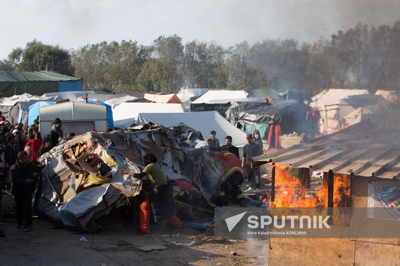 Relocation continues at Jungle spontaneous refugee camp in Calais, France