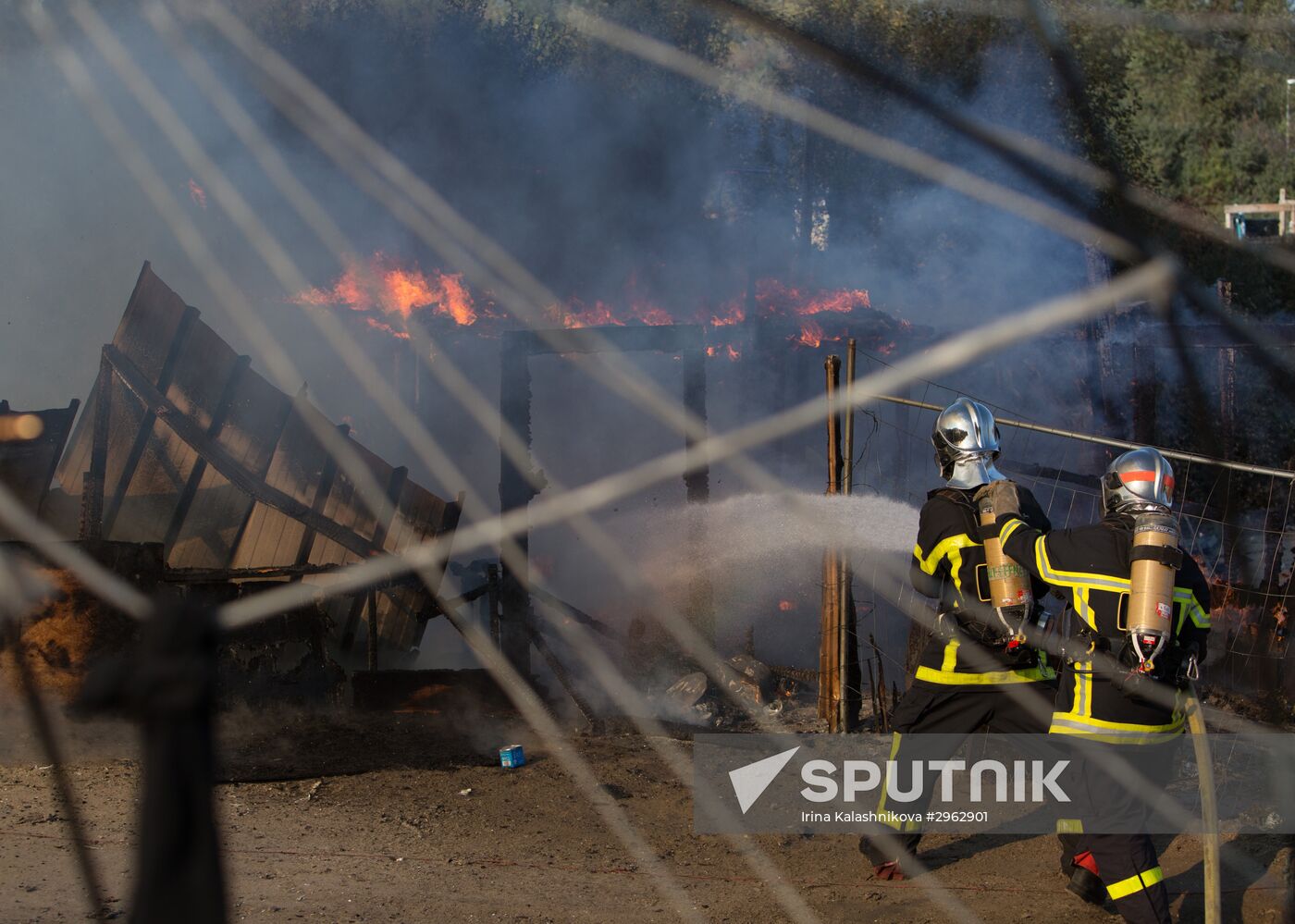 Relocation continues at Jungle spontaneous refugee camp in Calais, France