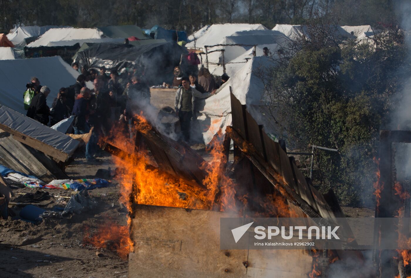 Relocation continues at Jungle spontaneous refugee camp in Calais, France