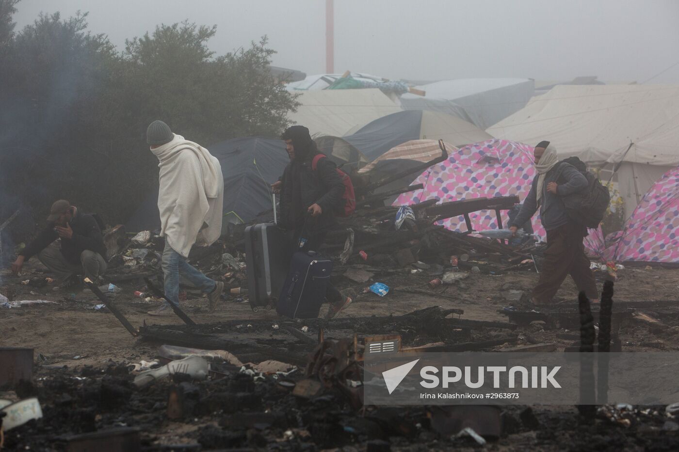 Relocation continues at Jungle spontaneous refugee camp in Calais, France