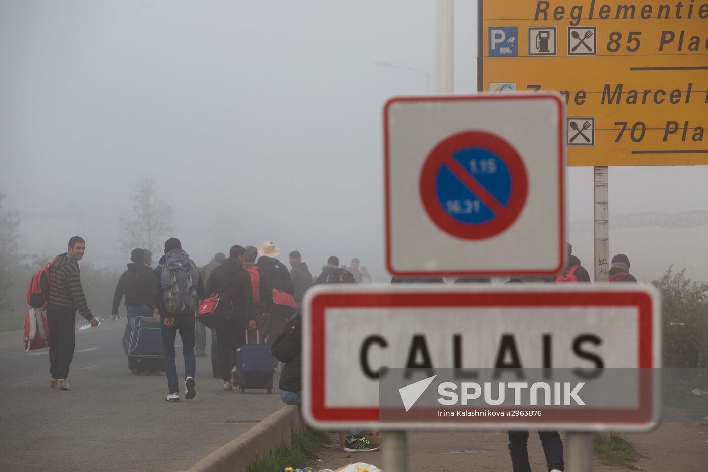 Relocation continues at Jungle spontaneous refugee camp in Calais, France