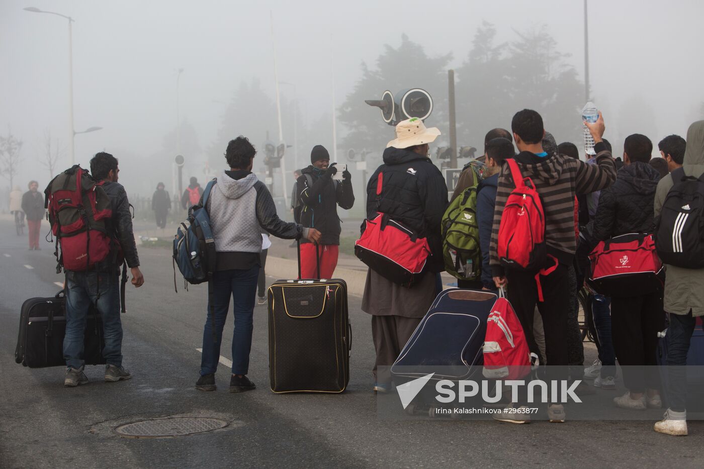 Relocation continues at Jungle spontaneous refugee camp in Calais, France