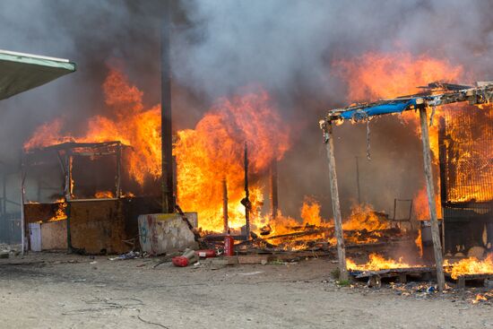 Relocation continues at Jungle spontaneous refugee camp in Calais, France