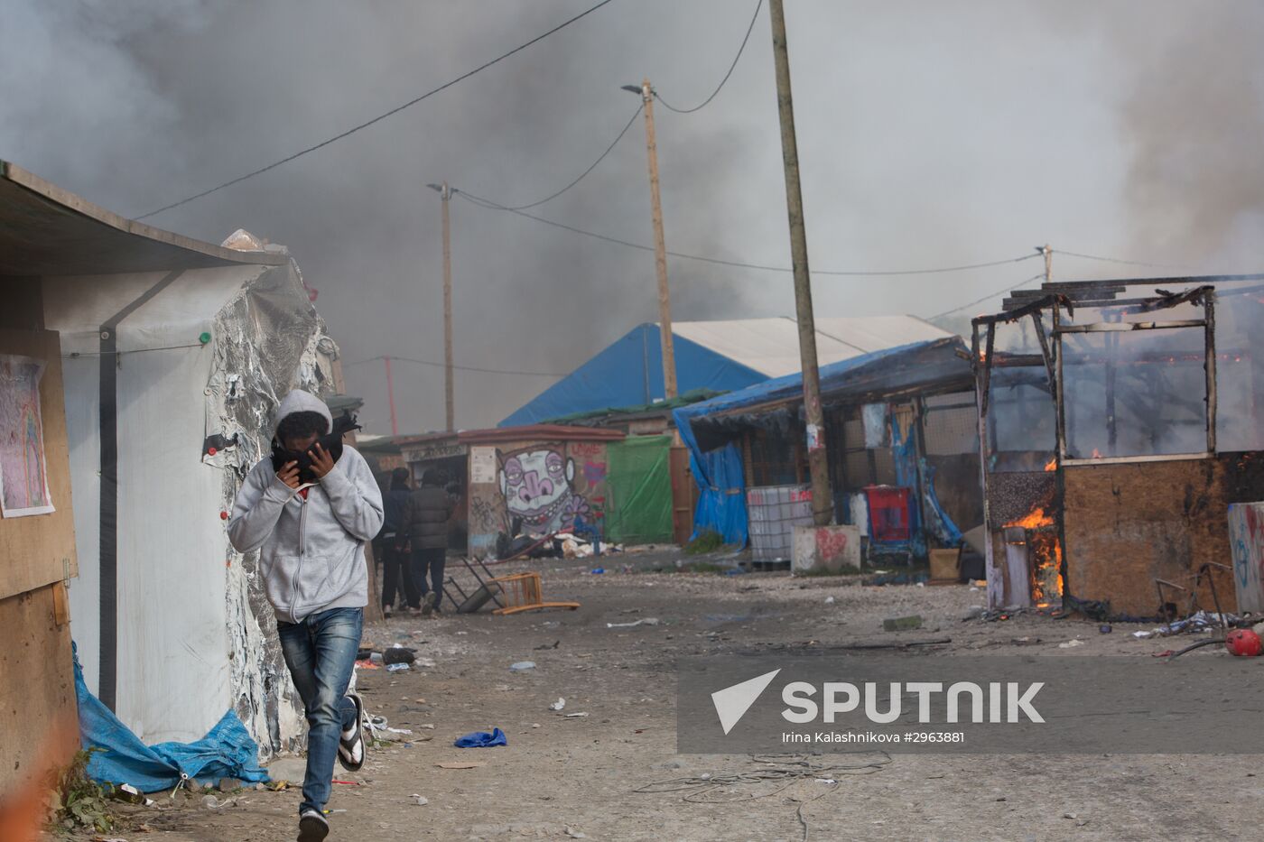 Relocation continues at Jungle spontaneous refugee camp in Calais, France