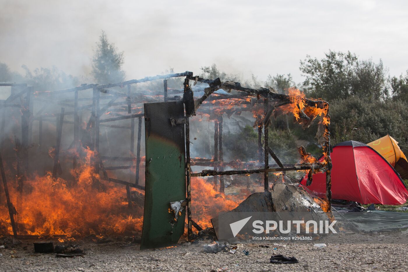 Relocation continues at Jungle spontaneous refugee camp in Calais, France