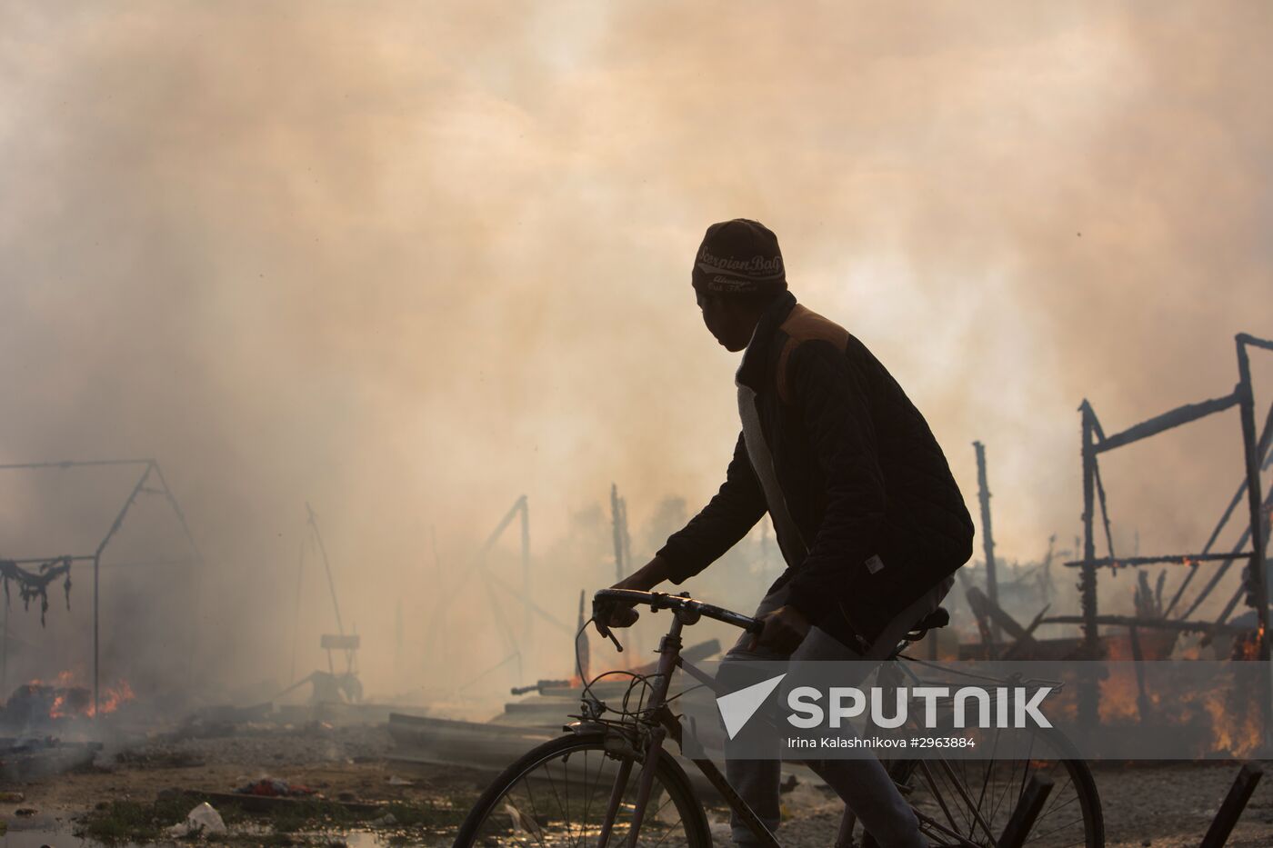 Relocation continues at Jungle spontaneous refugee camp in Calais, France