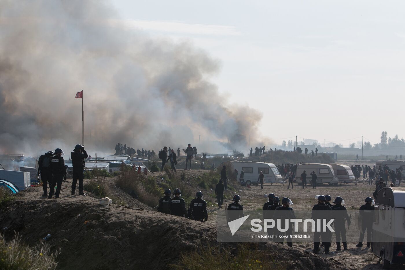 Relocation continues at Jungle spontaneous refugee camp in Calais, France