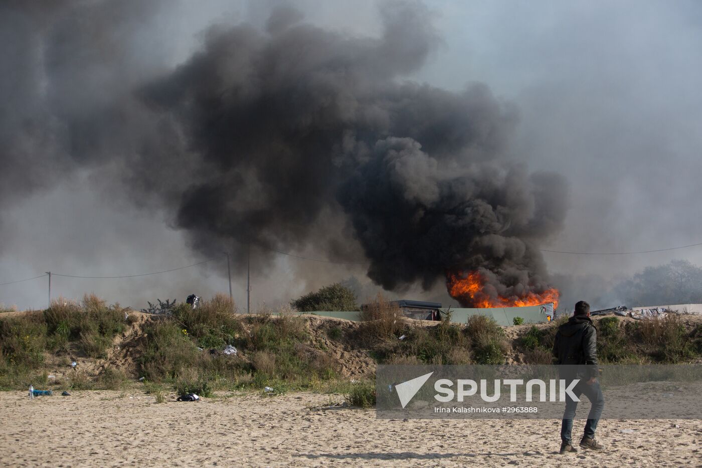 Relocation continues at Jungle spontaneous refugee camp in Calais, France