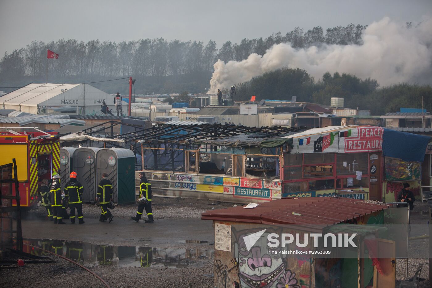 Relocation continues at Jungle spontaneous refugee camp in Calais, France