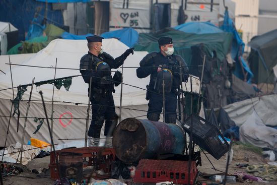 Relocation continues at Jungle spontaneous refugee camp in Calais, France