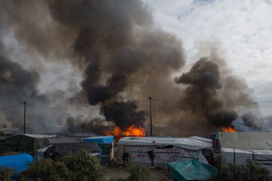 Relocation continues at Jungle spontaneous refugee camp in Calais, France