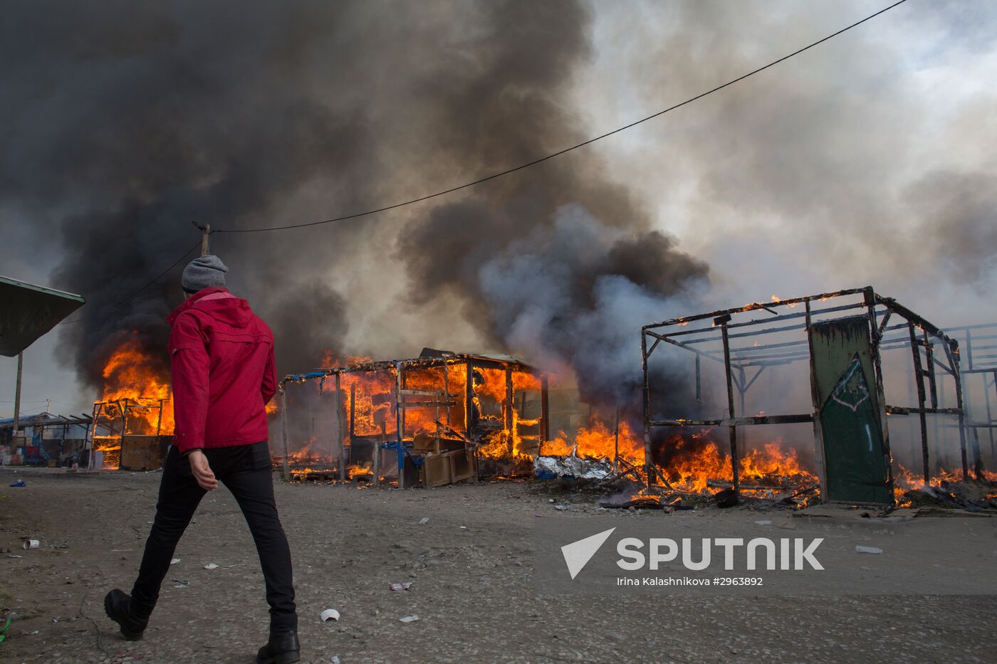 Relocation continues at Jungle spontaneous refugee camp in Calais, France