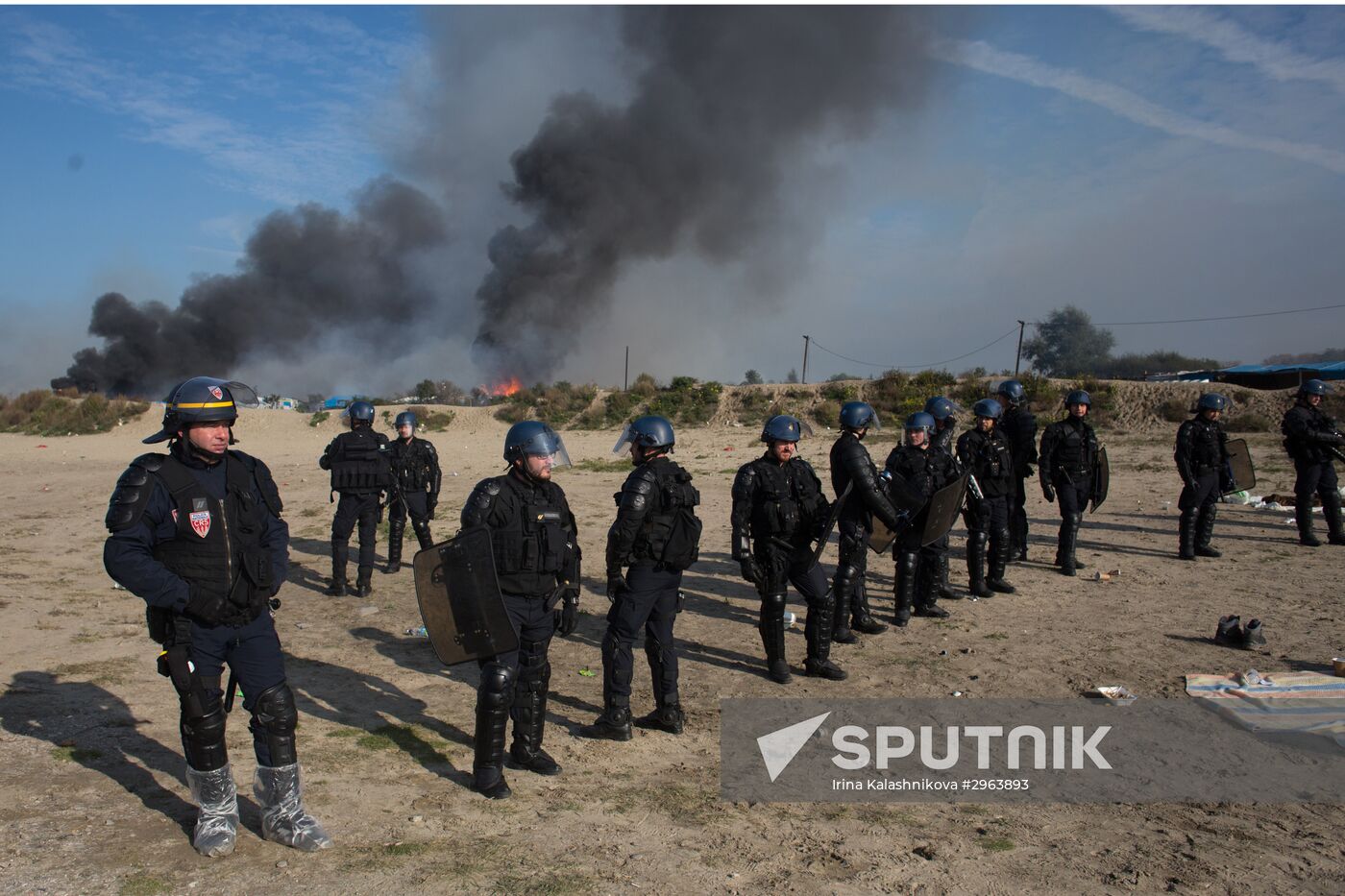 Relocation continues at Jungle spontaneous refugee camp in Calais, France