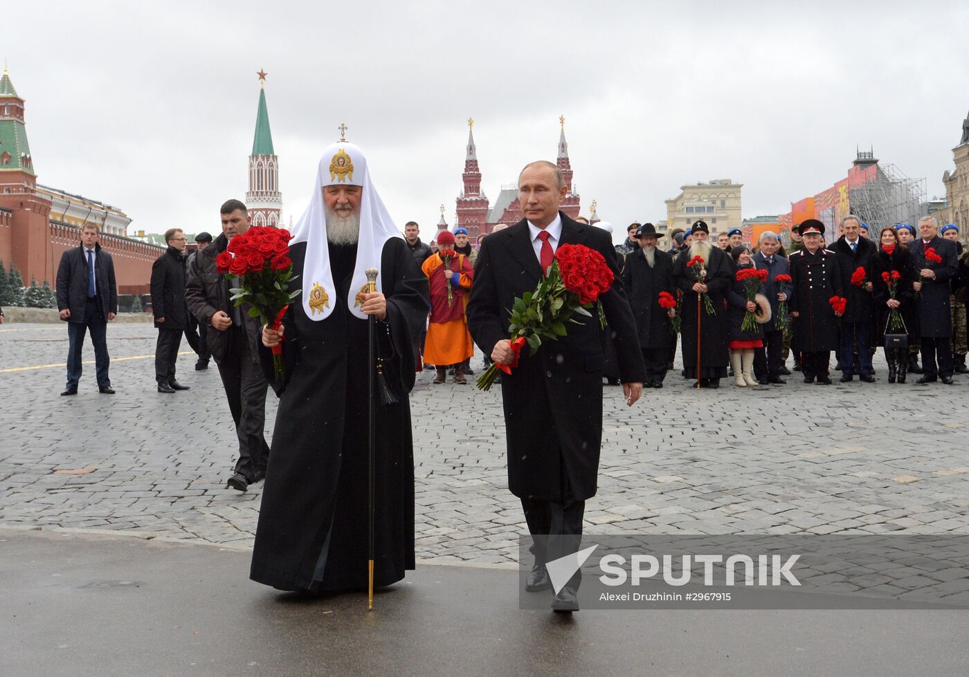 President Vladimir Putin lays flowers at Minin and Pozharsky monument on Red Square