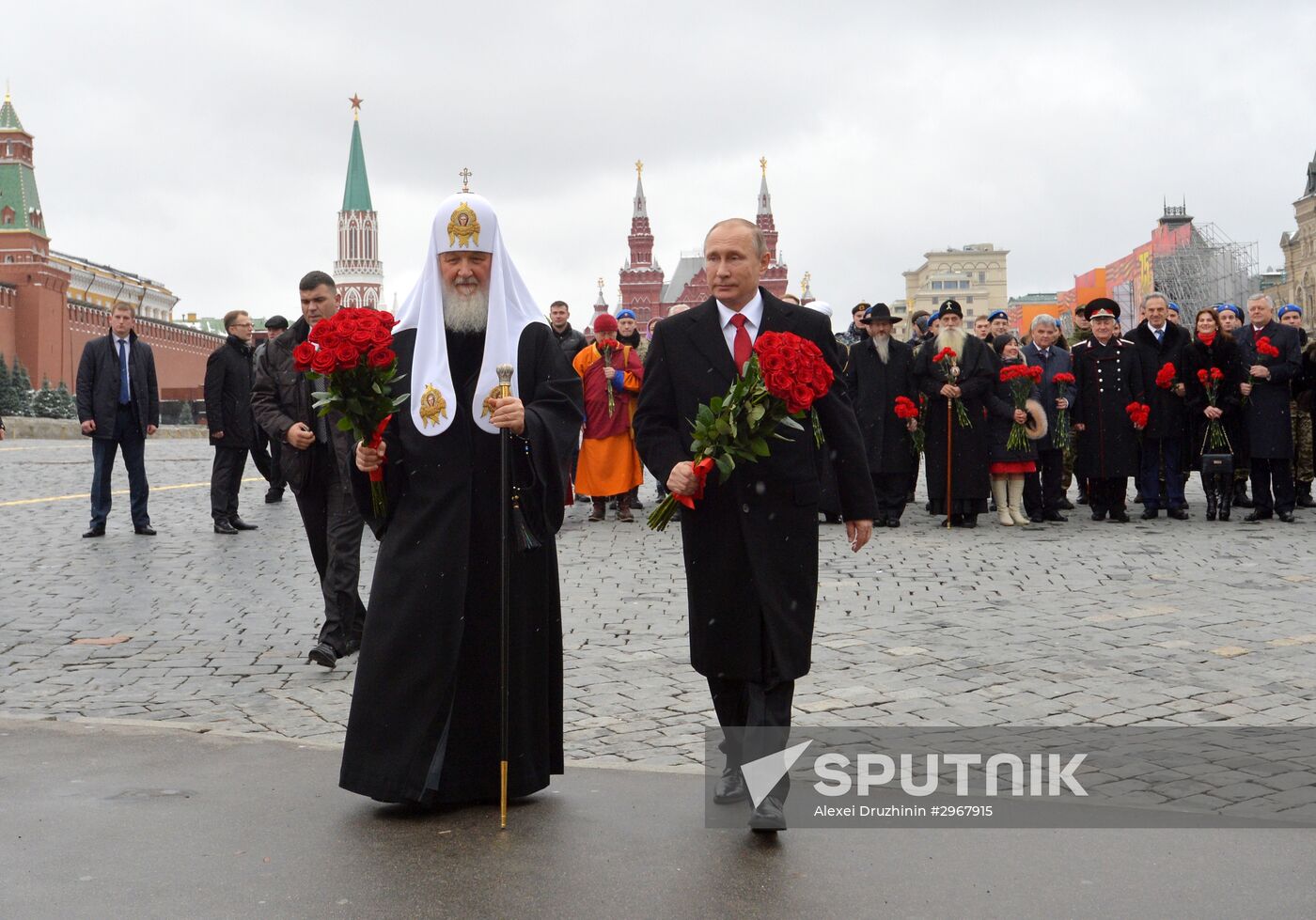 President Vladimir Putin lays flowers at Minin and Pozharsky monument on Red Square