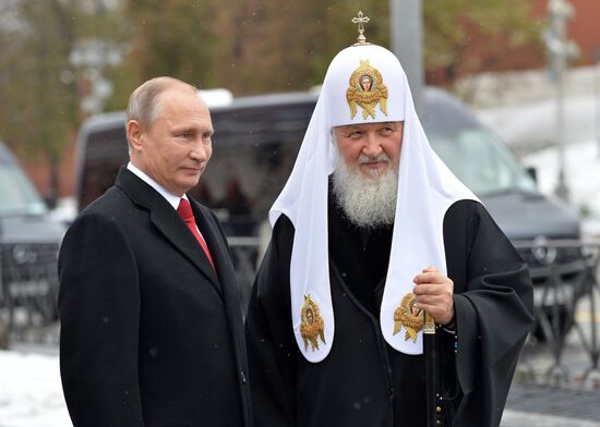 President Vladimir Putin lays flowers at Minin and Pozharsky monument on Red Square