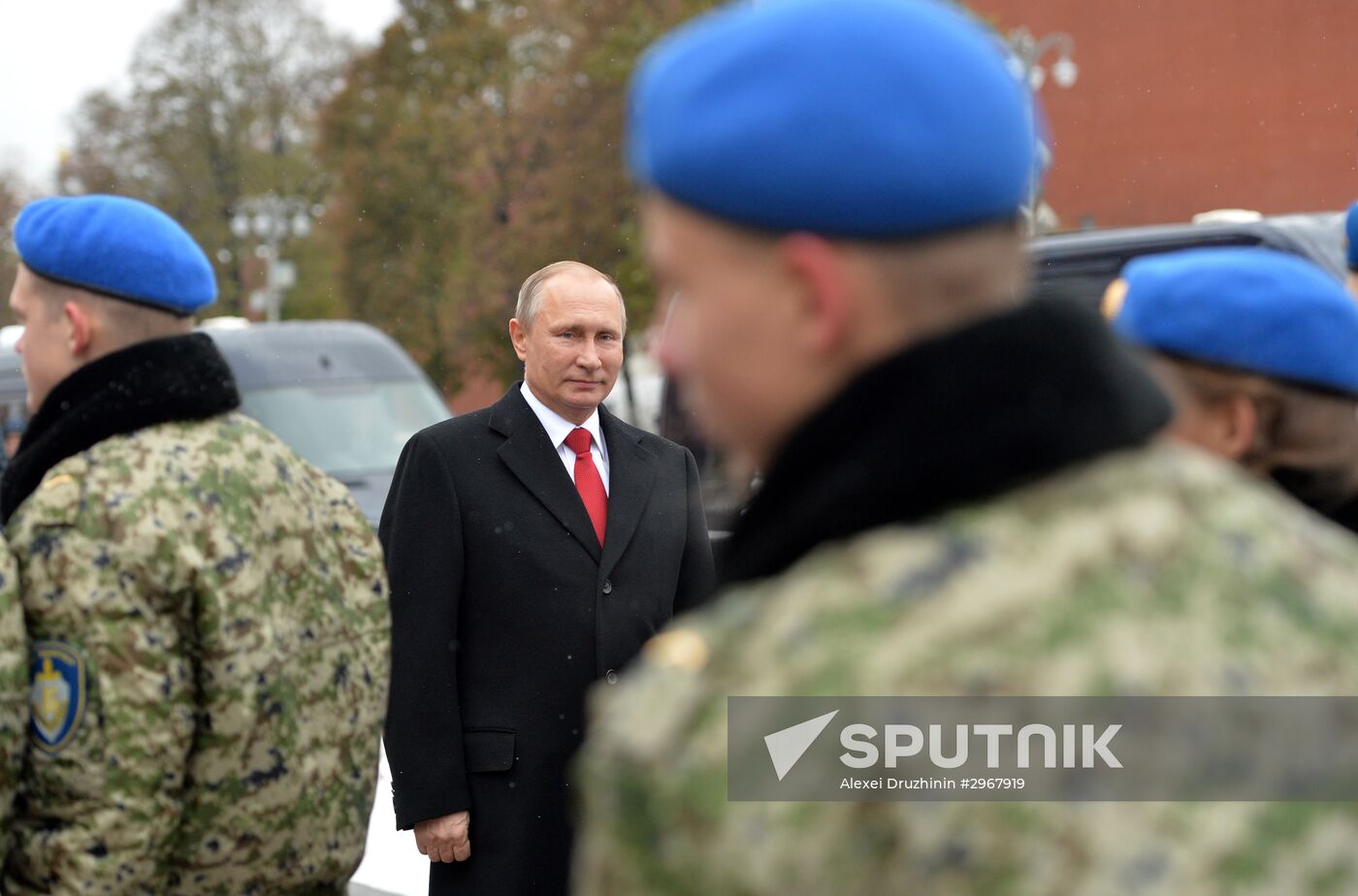 President Vladimir Putin lays flowers at Minin and Pozharsky monument on Red Square