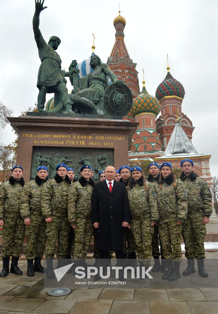 President Vladimir Putin lays flowers at Minin and Pozharsky monument on Red Square