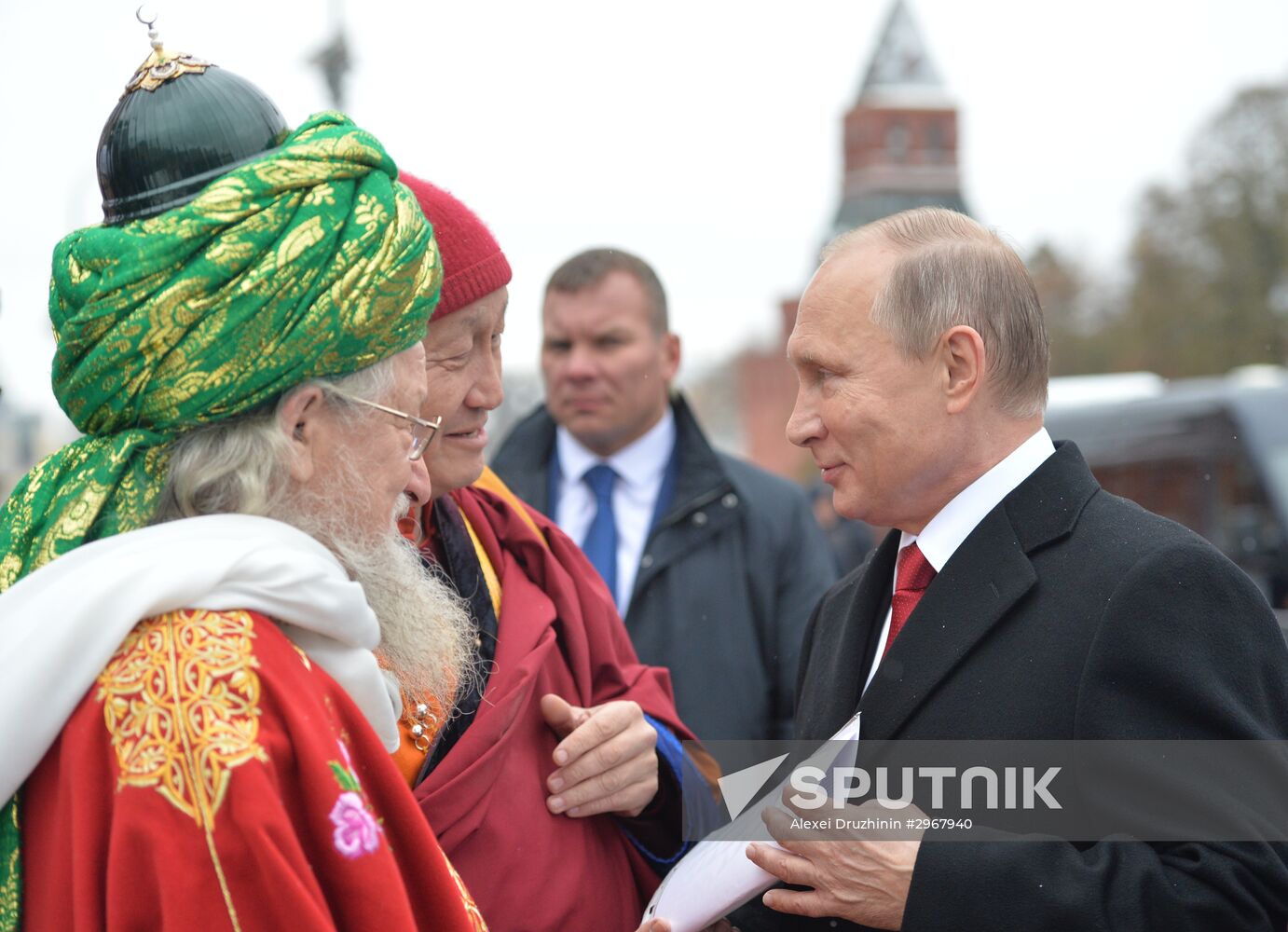 President Vladimir Putin lays flowers at Minin and Pozharsky monument on Red Square