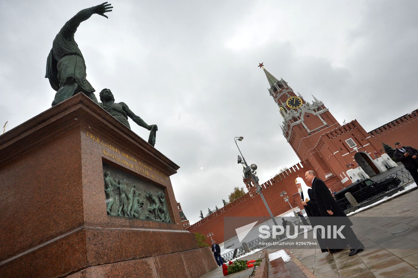 President Vladimir Putin lays flowers at Minin and Pozharsky monument on Red Square