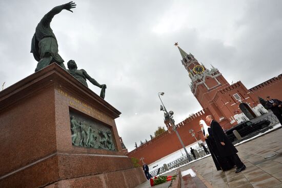 President Vladimir Putin lays flowers at Minin and Pozharsky monument on Red Square