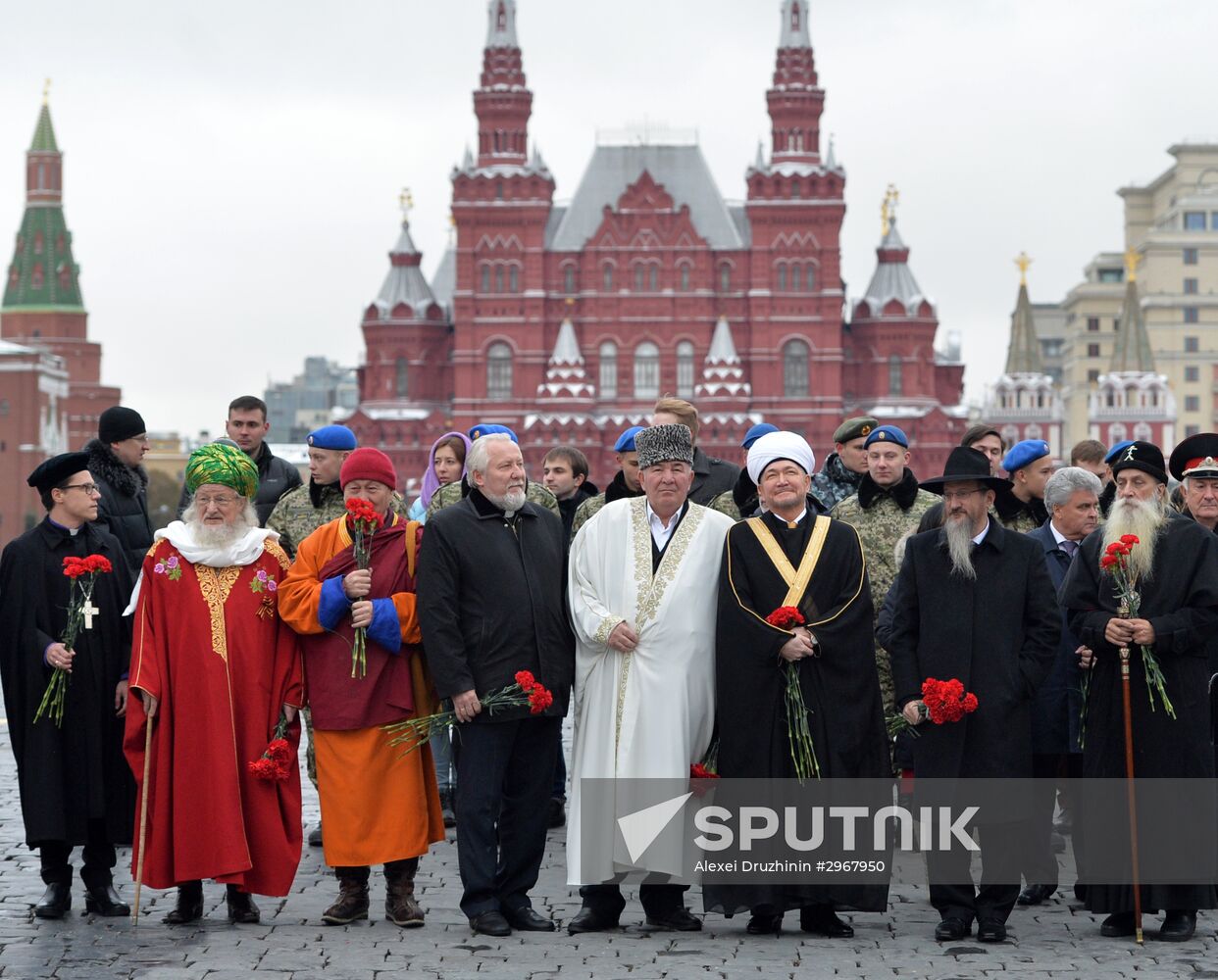 President Vladimir Putin lays flowers at Minin and Pozharsky monument on Red Square