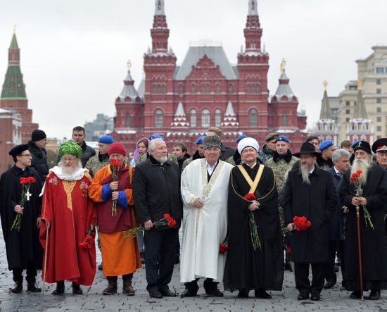 President Vladimir Putin lays flowers at Minin and Pozharsky monument on Red Square