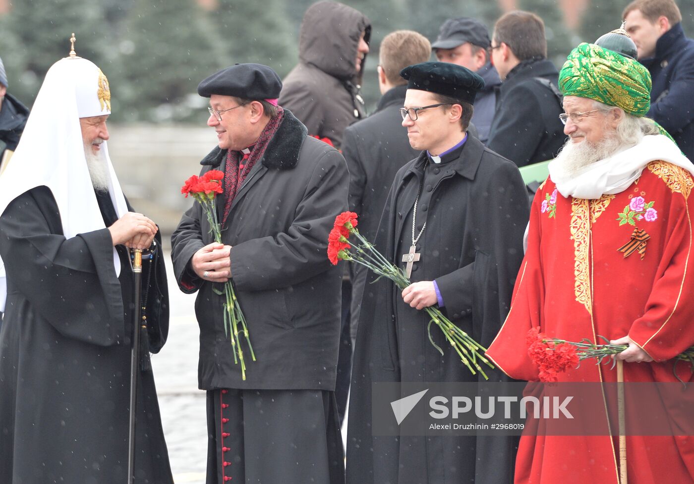 President Vladimir Putin lays flowers at Minin and Pozharsky monument on Red Square