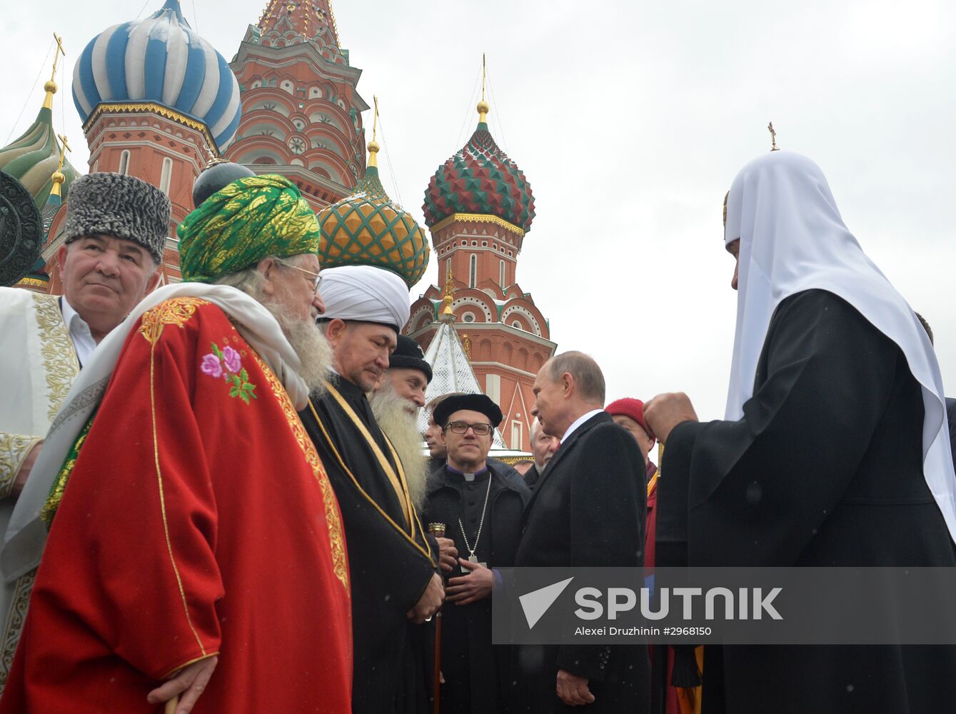 President Vladimir Putin lays flowers at Minin and Pozharsky monument on Red Square